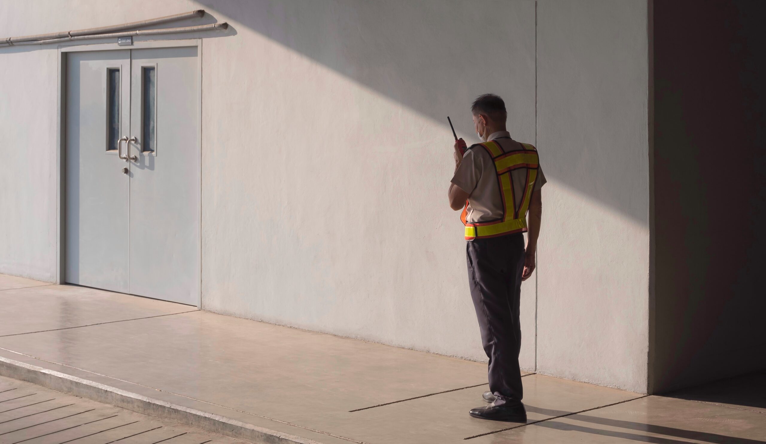 security-guard-using-walkie-talkie-while-working-i-2026-03-24-06-32-43-utc